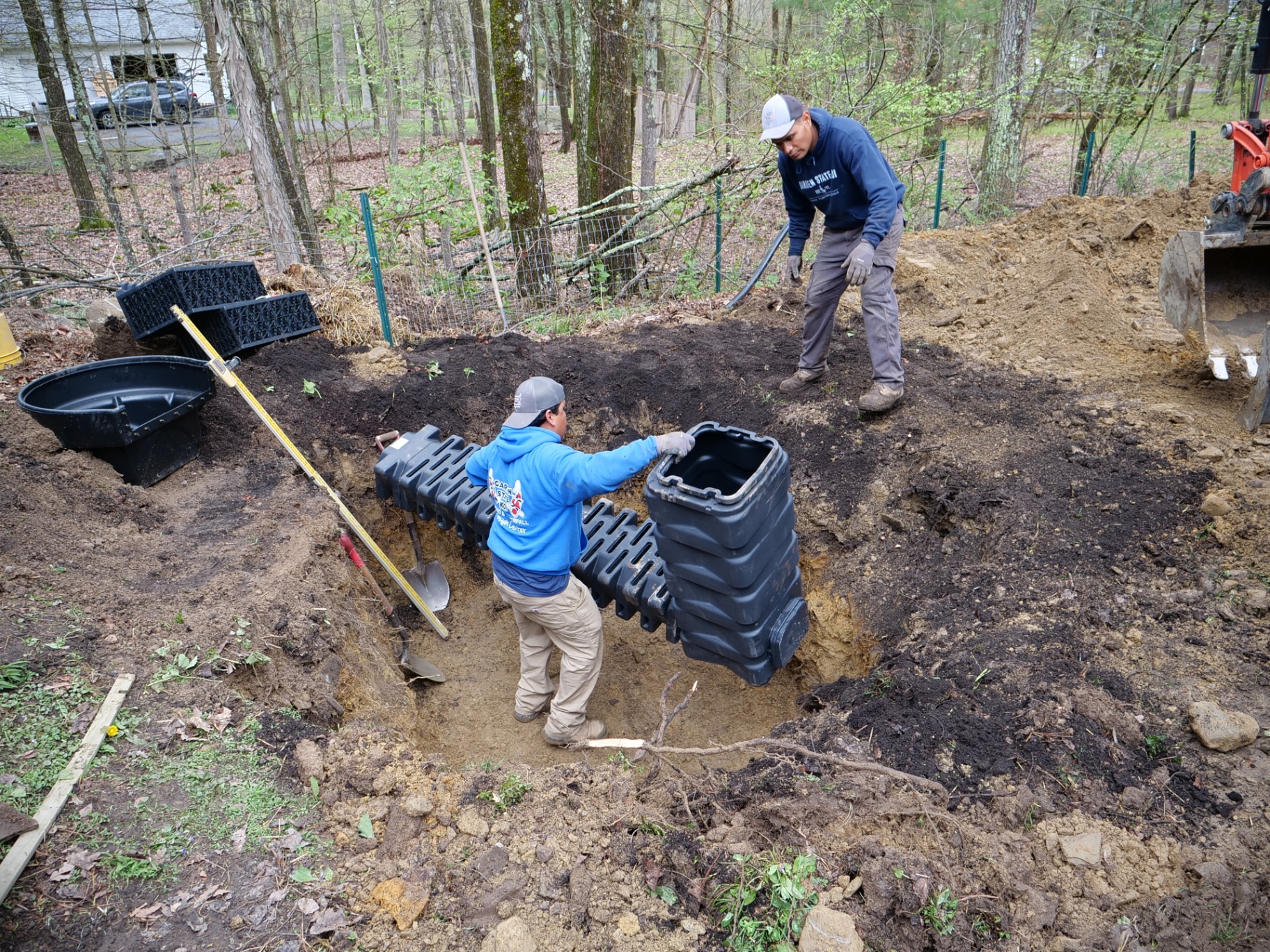 Setting the wetland filter and skimmer in the excavation