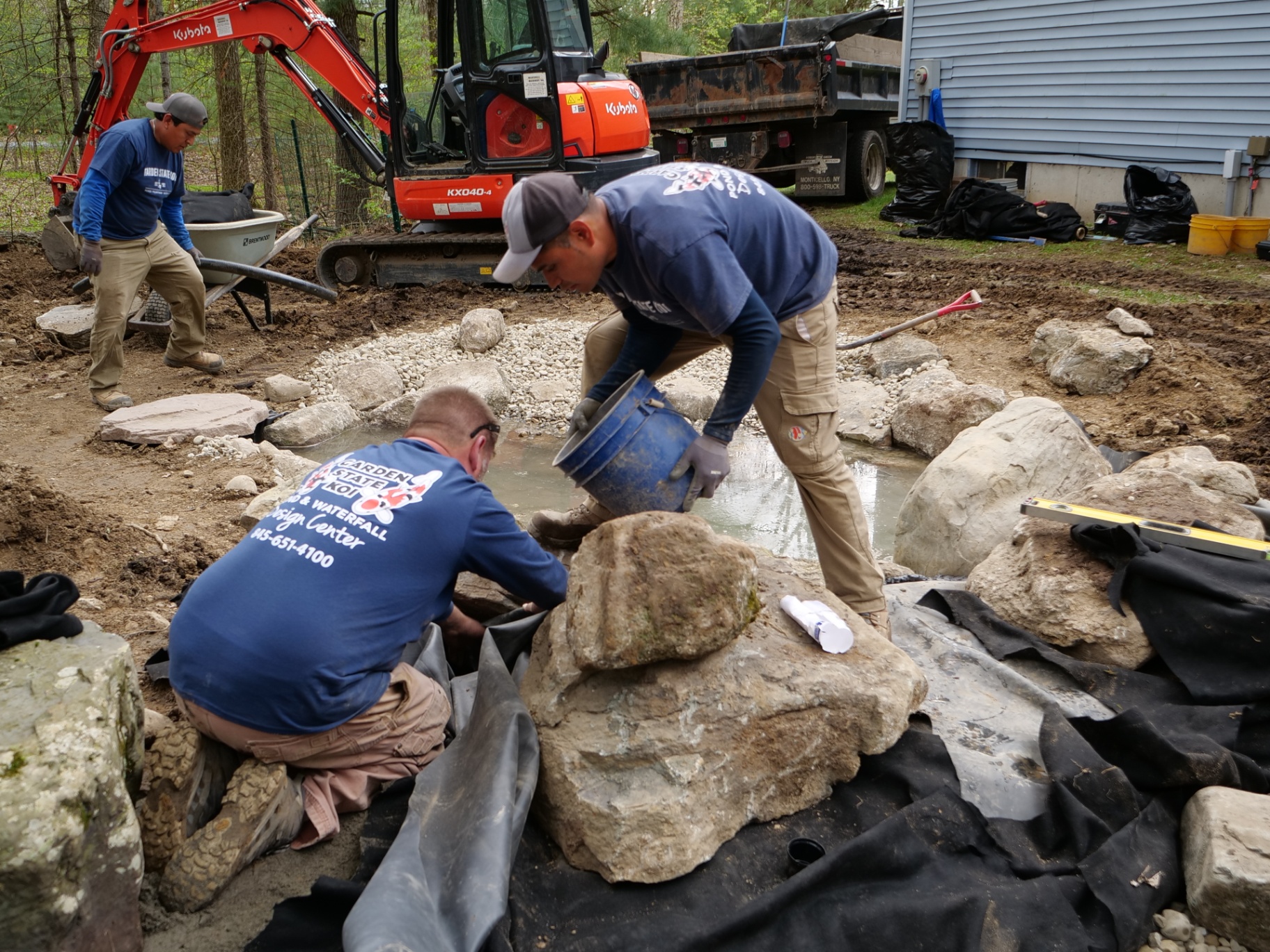 Building the rockwork and filling the new ecosystem pond