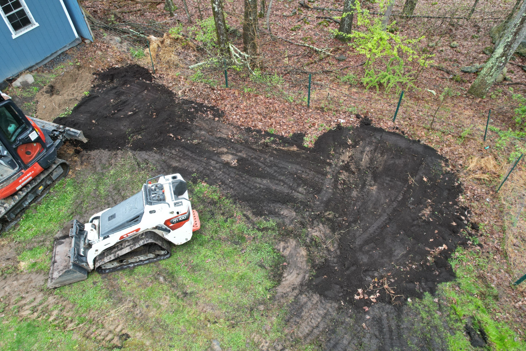 Krissy's backyard before — graded soil where the new ecosystem pond would go