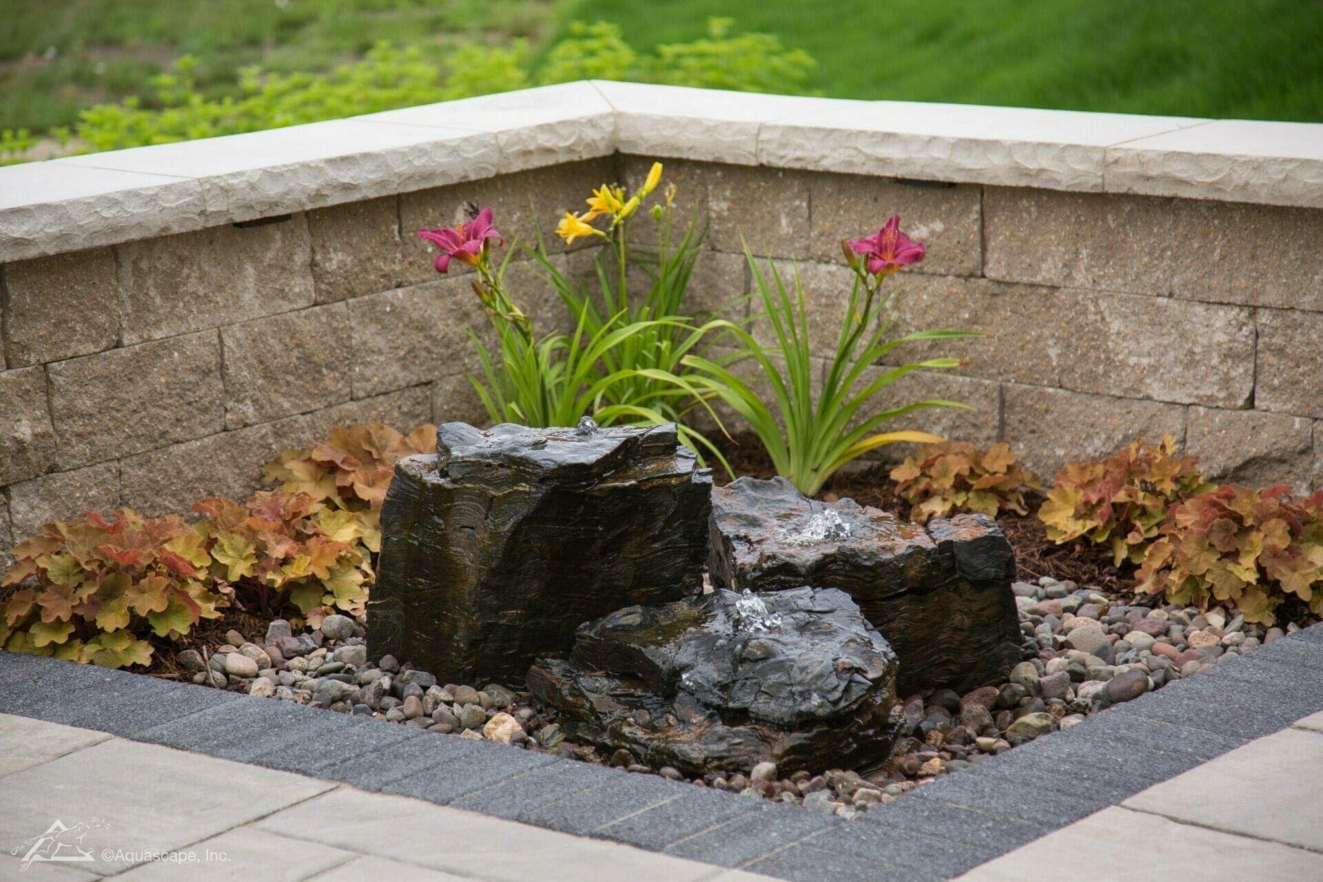 Small bubbling basalt rock fountain installed in a Hudson Valley patio