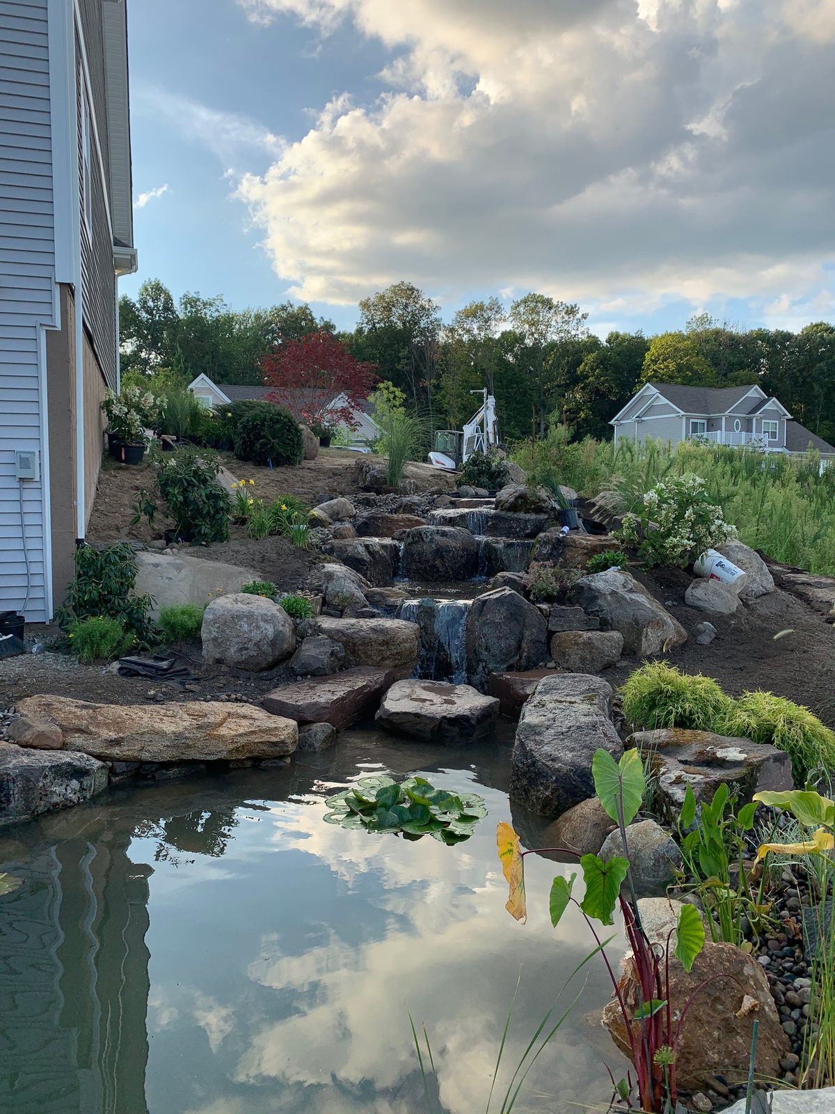 Completed 13x18 koi pond and waterfall, the homeowner vision realized