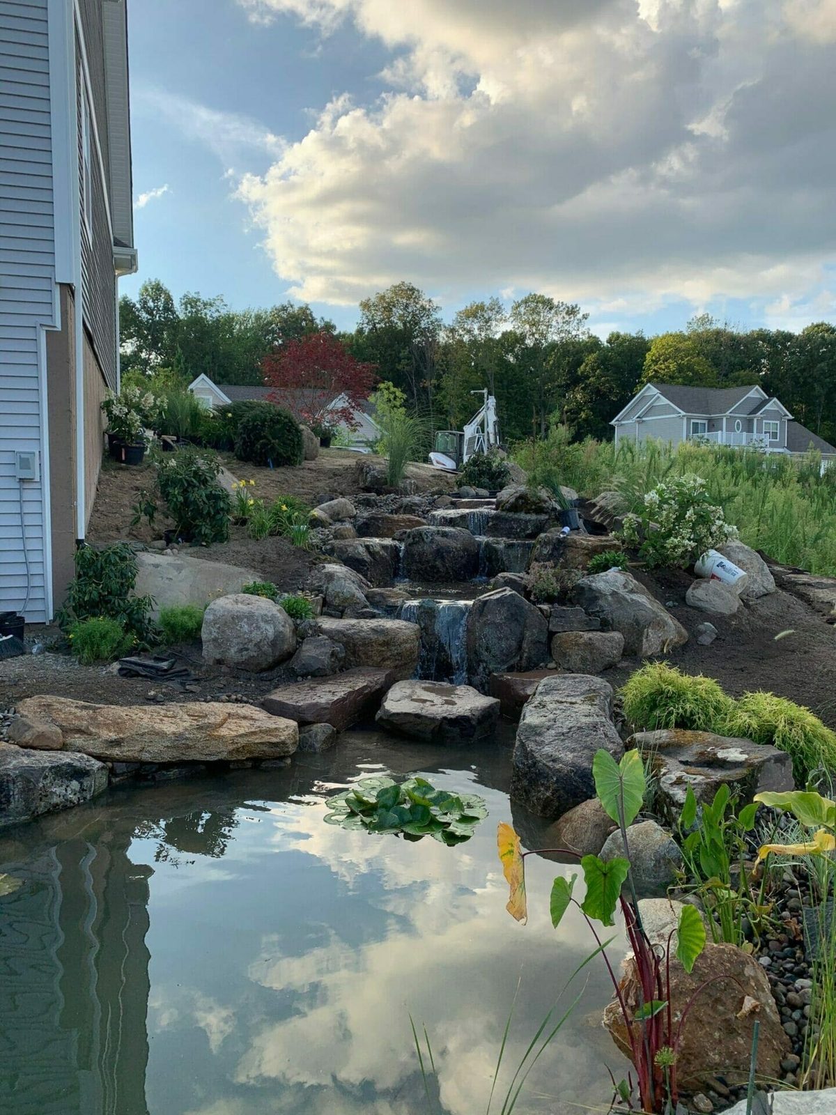 Finished waterfall on a 13x18 backyard pond, from design to reality