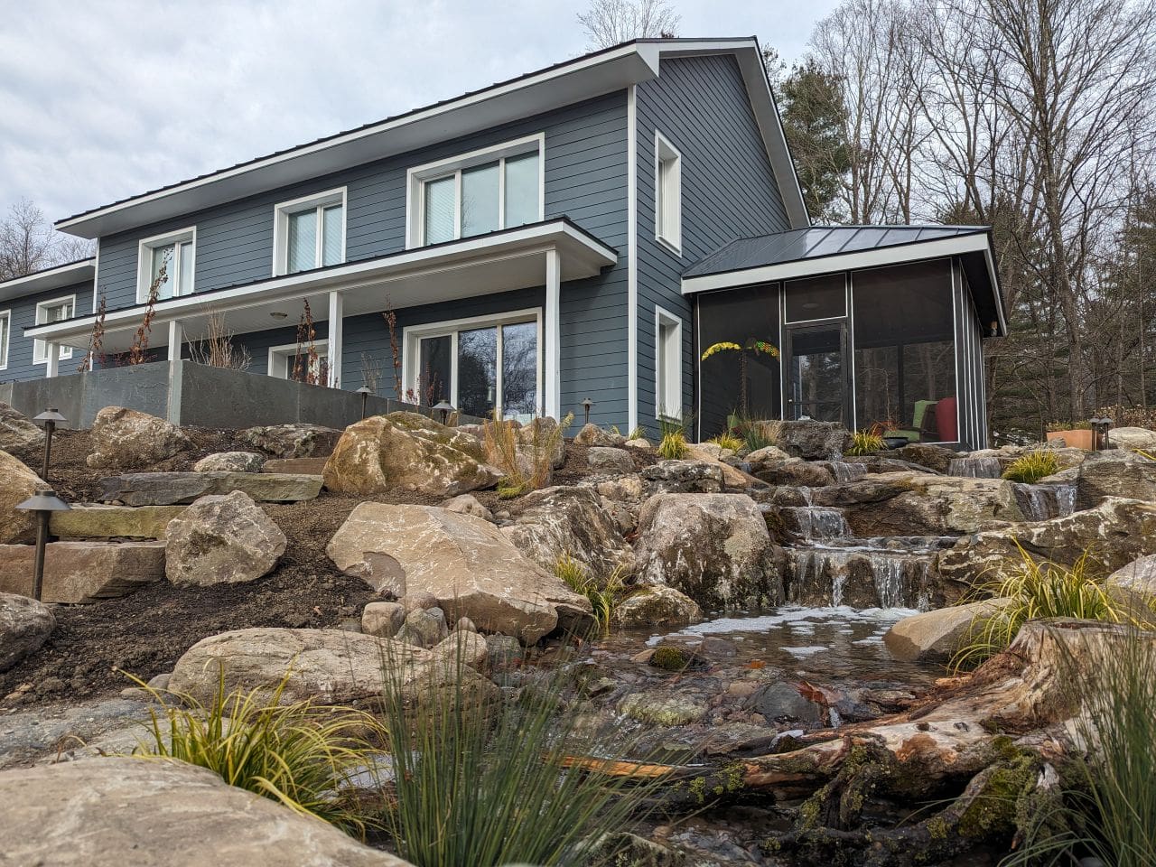 Backyard transformed by a new pondless waterfall installation in Woodstock, NY